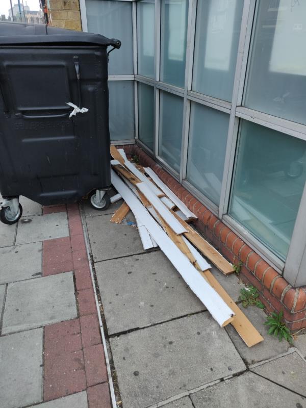 Skirting boards dumped behind skip outside Upton Lane Medical Centre -69-73 Upton Lane, London, E7 9LW