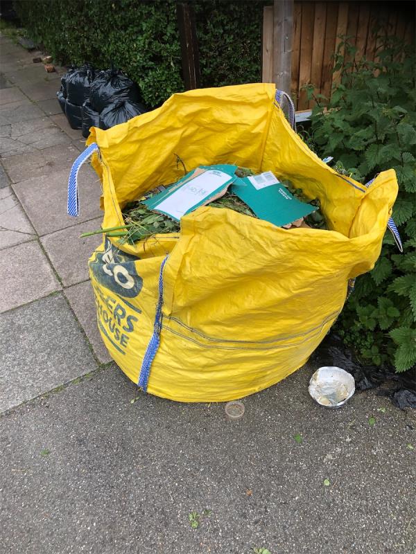 Outside no 73. Please clear a grab bag full of garden waste-71 Moremead Road, Bellingham, London, SE6 3LS