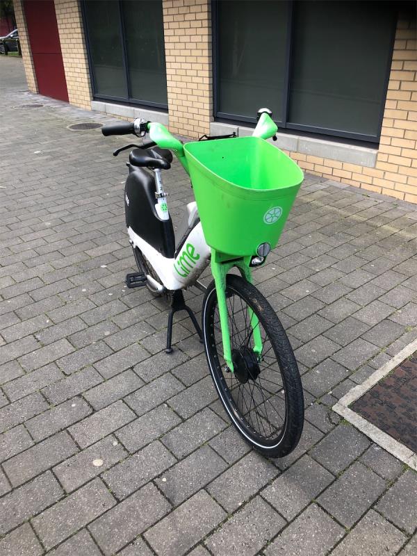 Side of block. Please remove an abandoned Lime bike-Flat 001, Empire Heights, 45 New Cross Road, London, SE14 5FA