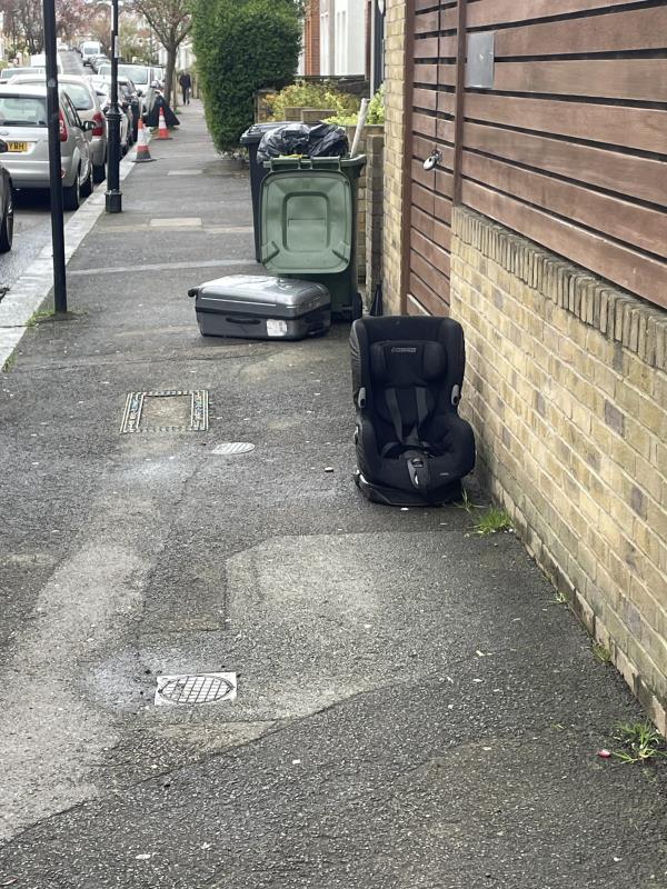 Suitcase and car baby seat dumped at end of Knighton Park Road. -1 Knighton Park Road, London, SE26 5RJ