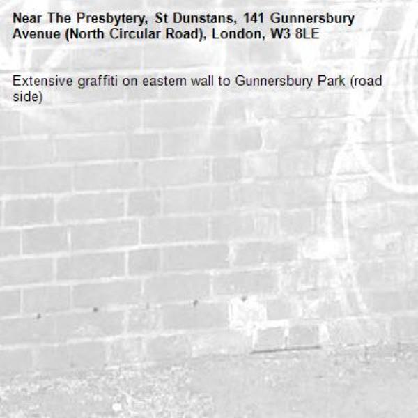 Extensive graffiti on eastern wall to Gunnersbury Park (road side)-The Presbytery, St Dunstans, 141 Gunnersbury Avenue (North Circular Road), London, W3 8LE