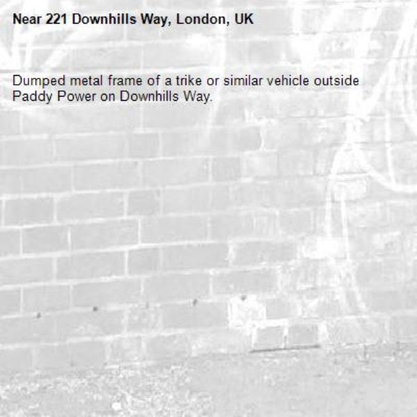 Dumped metal frame of a trike or similar vehicle outside Paddy Power on Downhills Way. -221 Downhills Way, London, UK