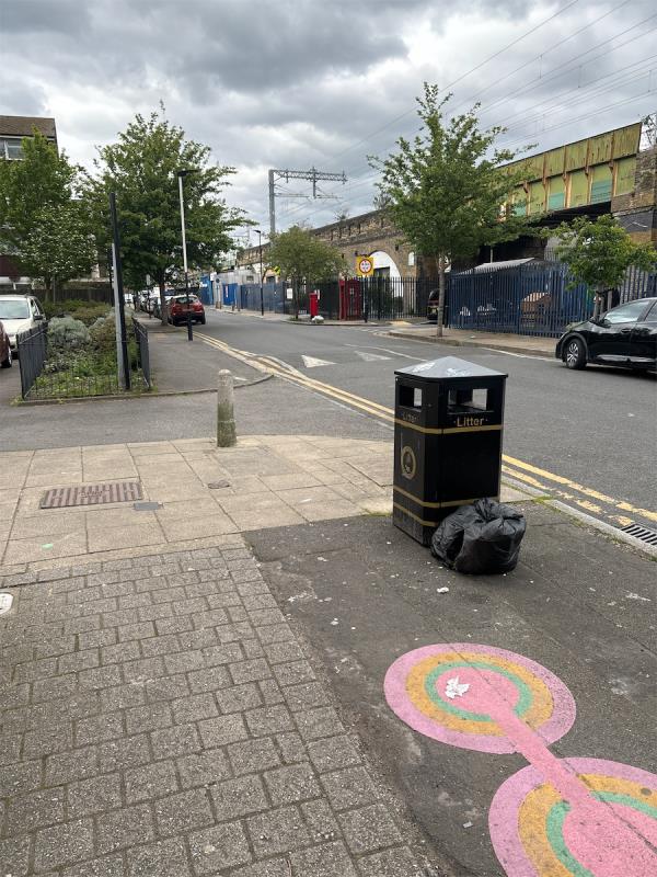 Flytipped domestic bin bag spilling onto street-Field Community Centre, 147 Station Road, Forest Gate, London, E7 0AE