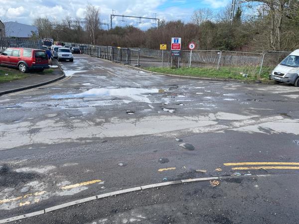 Multiple potholes at junction-Wigmore Lane, Reading