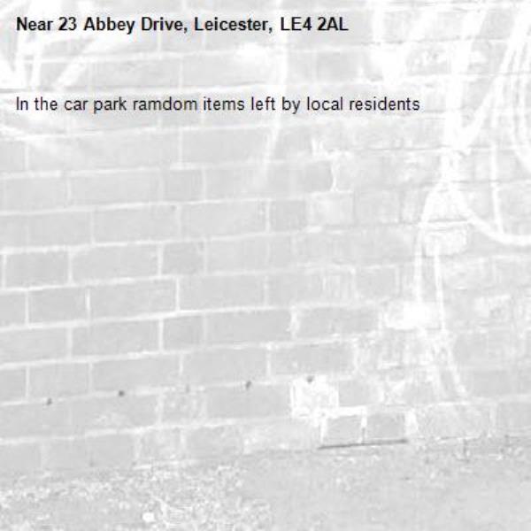 In the car park ramdom items left by local residents -23 Abbey Drive, Leicester, LE4 2AL