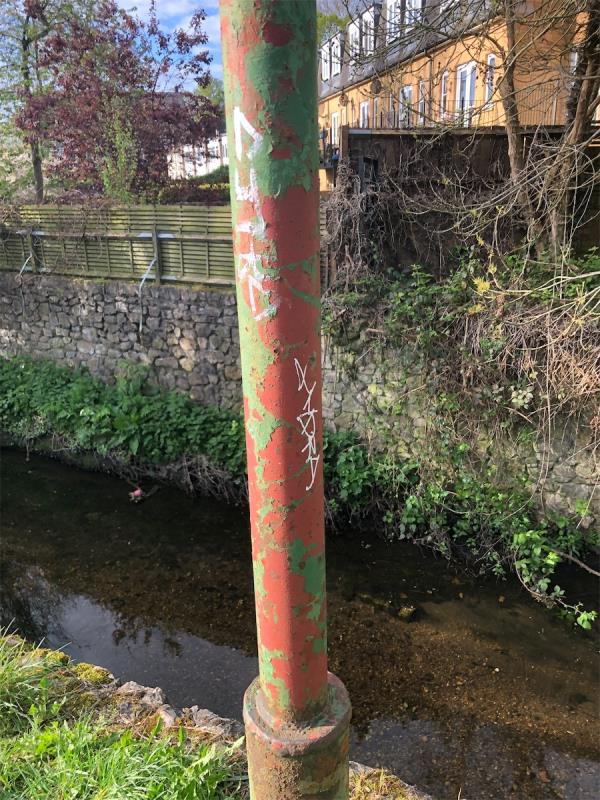 Former Cricket pitch. Remove graffiti from former lamppost-222 Ravensbourne Avenue, Bromley, BR3 5HG