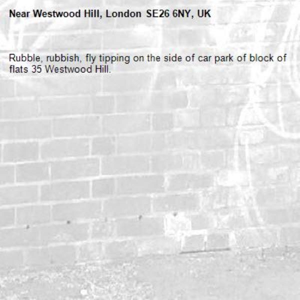 Rubble, rubbish, fly tipping on the side of car park of block of flats 35 Westwood Hill. -Westwood Hill, London SE26 6NY, UK